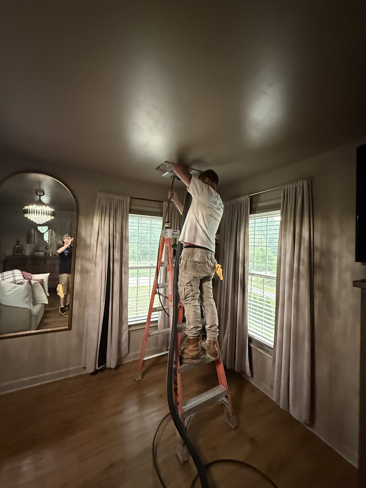 Pure Airways technician servicing a duct register